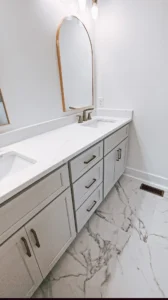 Bathroom renovation in Monroe NC with cabinet installation, painting, and mirror installation.