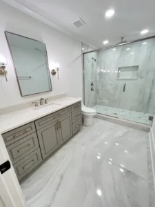 Complete bathroom remodel in Monroe NC with plumbing, walls, flooring, cabinet installation, and painting.