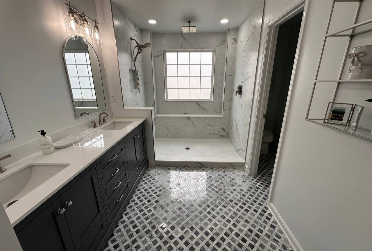 Master bathroom renovation in Matthews NC with old small bathroom demolished and shower relocated to create a larger modern shower area.