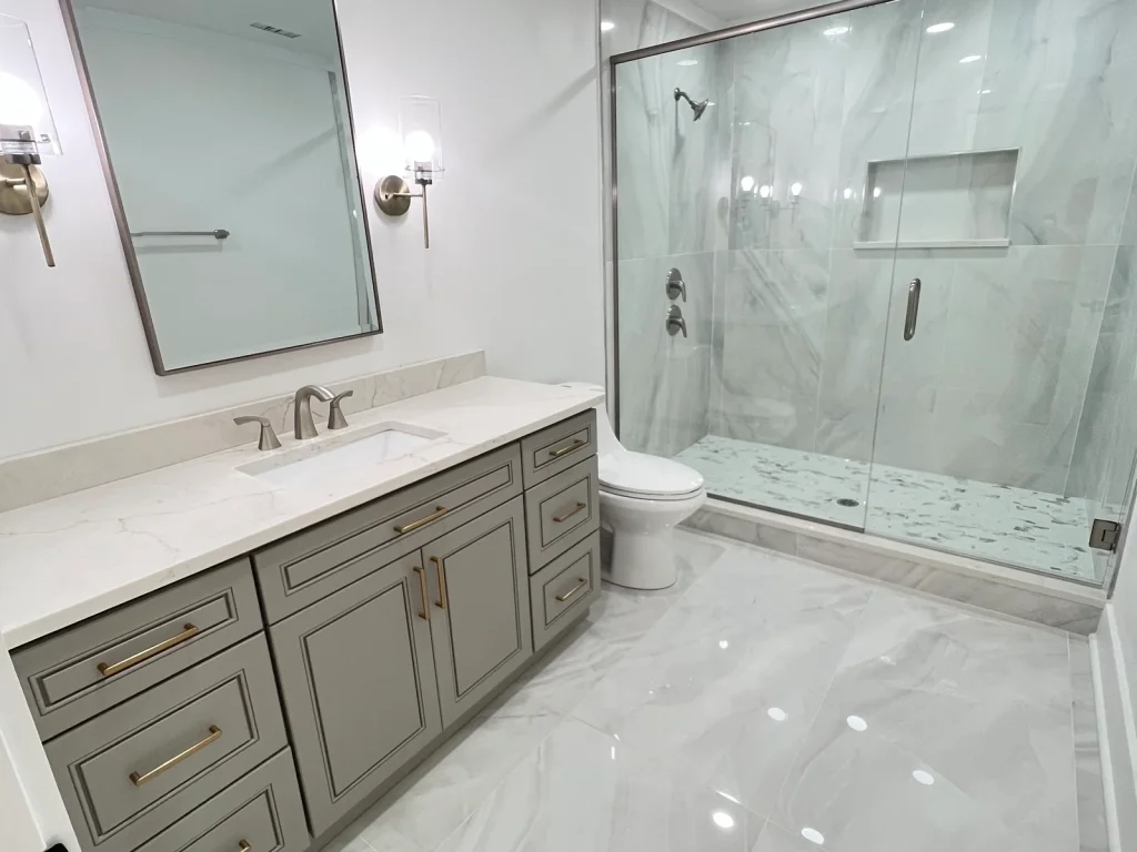 Complete bathroom remodel in Monroe NC with plumbing, walls, flooring, cabinet installation, and painting.